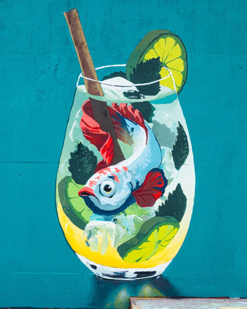 A mural of a fish in a cocktail
